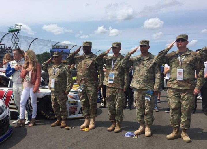 Soldiers saluting at NASCAR event