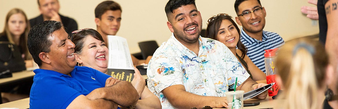 Group of people sitting and smiling